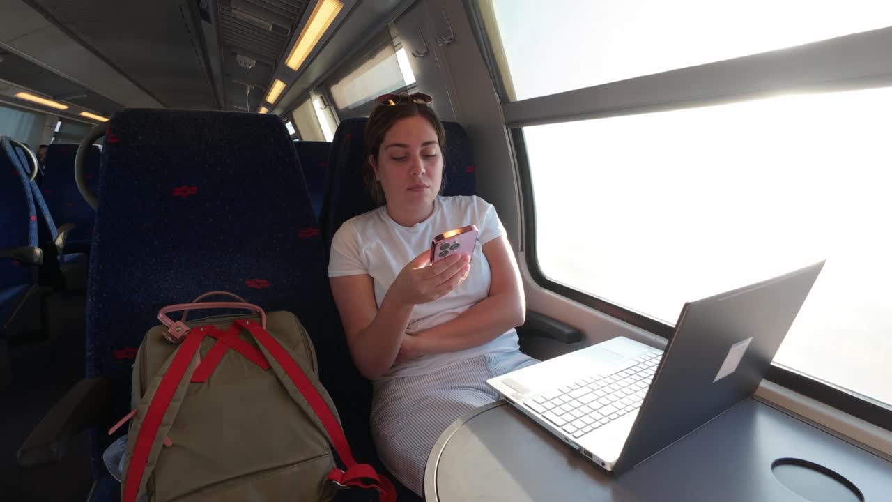 Young Passenger Browsing Her Mobile Device During a Commute