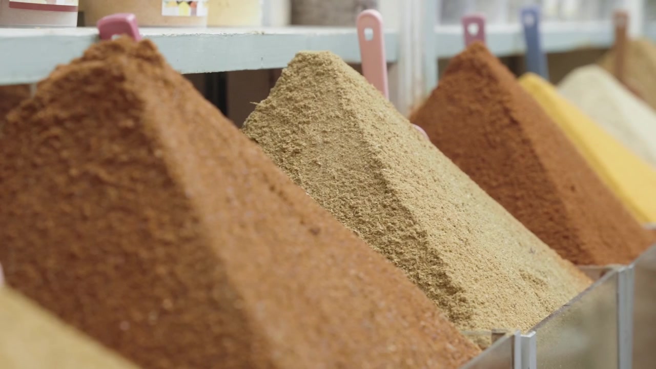 Delicious fresh piles of seasoning in Morocco market, close up view