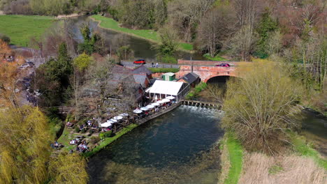 aerial panning over mayfly pub sunny day uk 4k