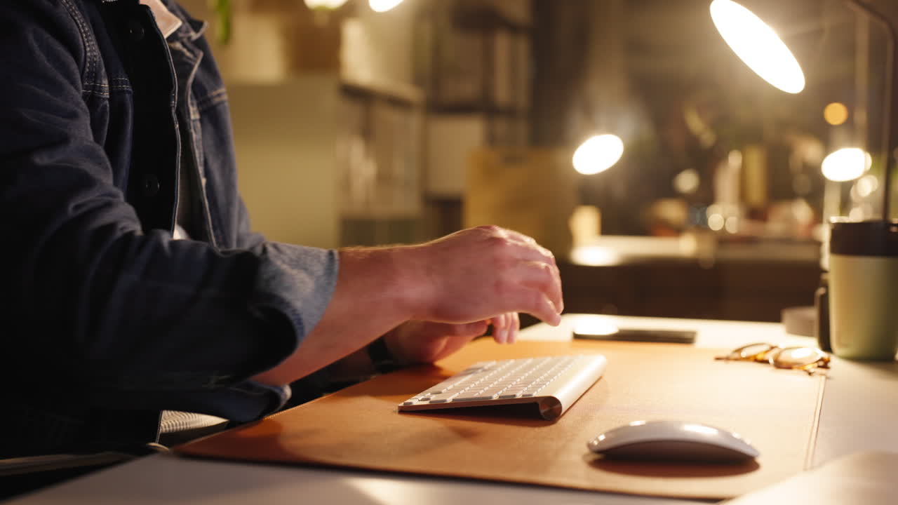 Typing on a keyboard at a desk
