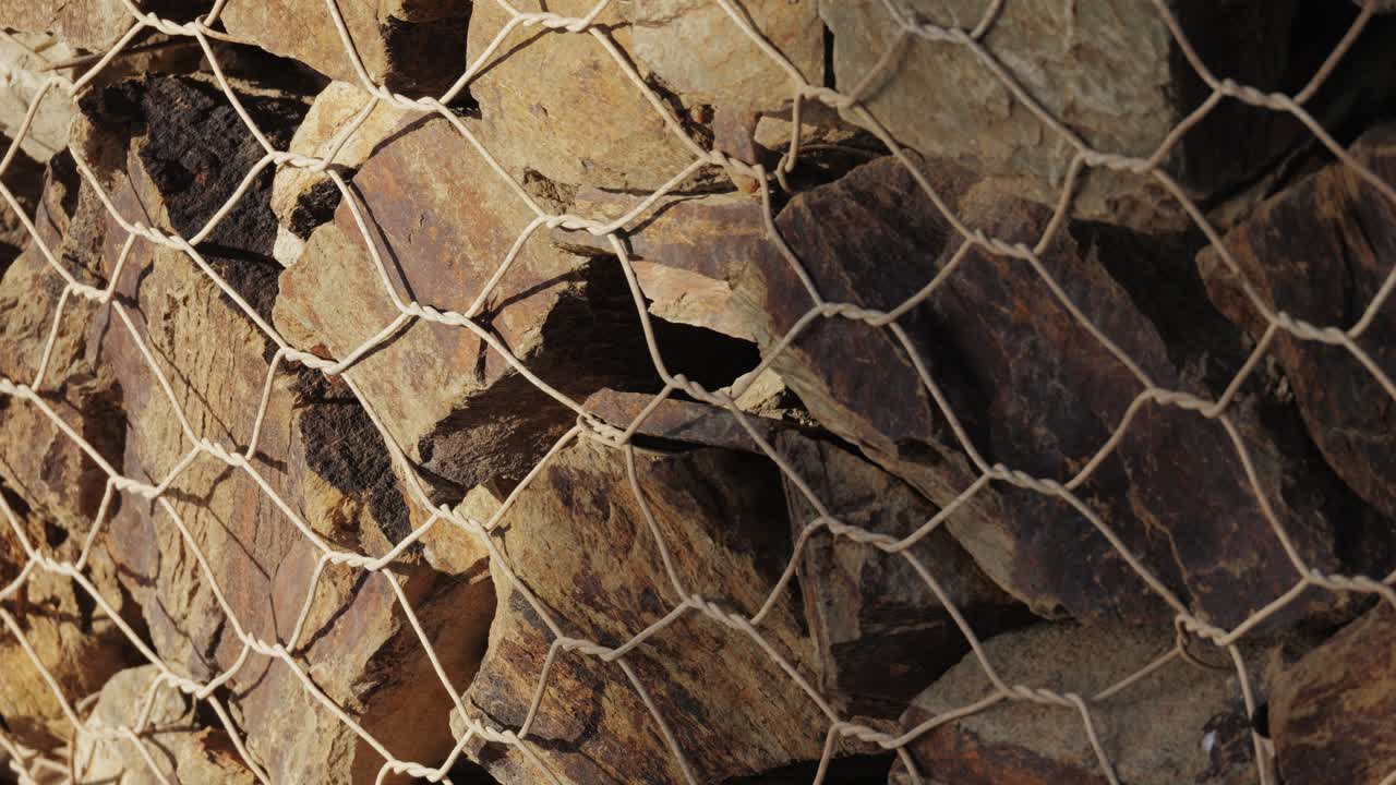 Stacked Rocks in a Wire Mesh