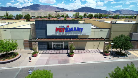 petsmart. aerial drone shot of famous american superstore retail chain brand for pet supplies and services during bright summer day.