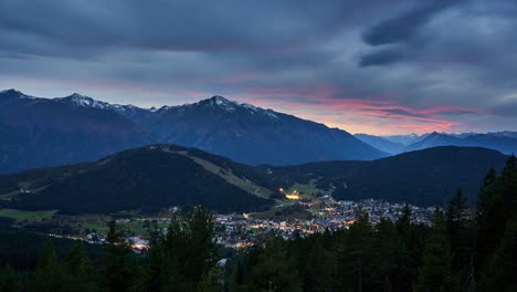 late sunset timelapse over the town of seefeld in tirol and the mountains of the alps, austria