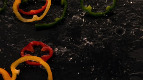 pepper slices falling into water