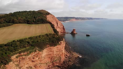 Aerial-Along-Coastal-Cliffs-And-Empty-Beach-Beside-English-Channel-In-Devon