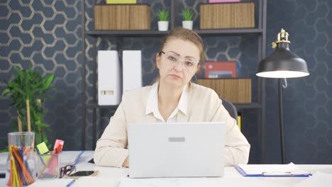 bored business woman looking at camera and sighing.