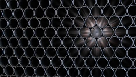 abstract background of steel pipes stacked on a pallet