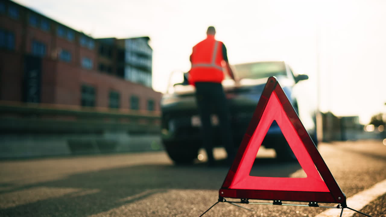 Car Breakdown on the Road with Warning Triangle