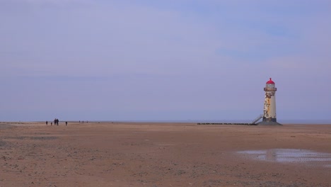 The-beautiful-Point-of-Ayr-lighthouse-in-Wales-in-golden-light