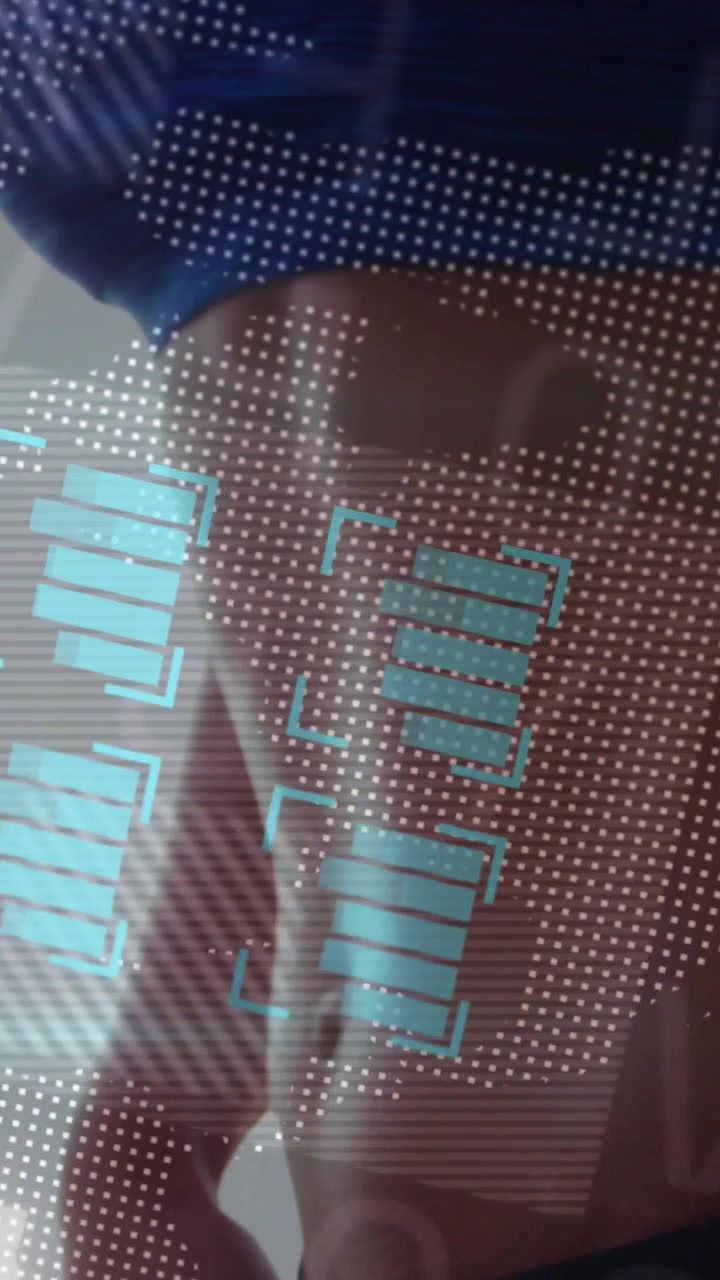Vertical video: Woman rotating torso as dotted grid appearing, health HUD highlighting hip for scan