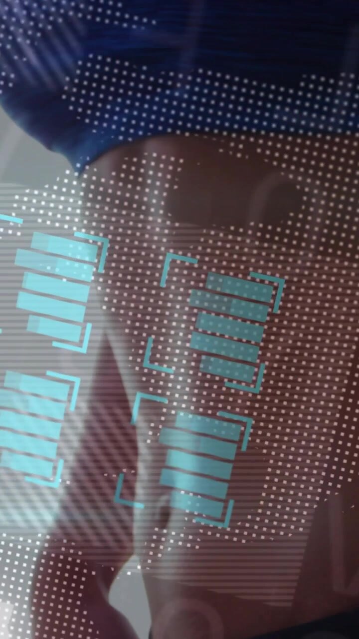Vertical video: Woman rotating torso as dotted grid appearing, health HUD highlighting hip for scan