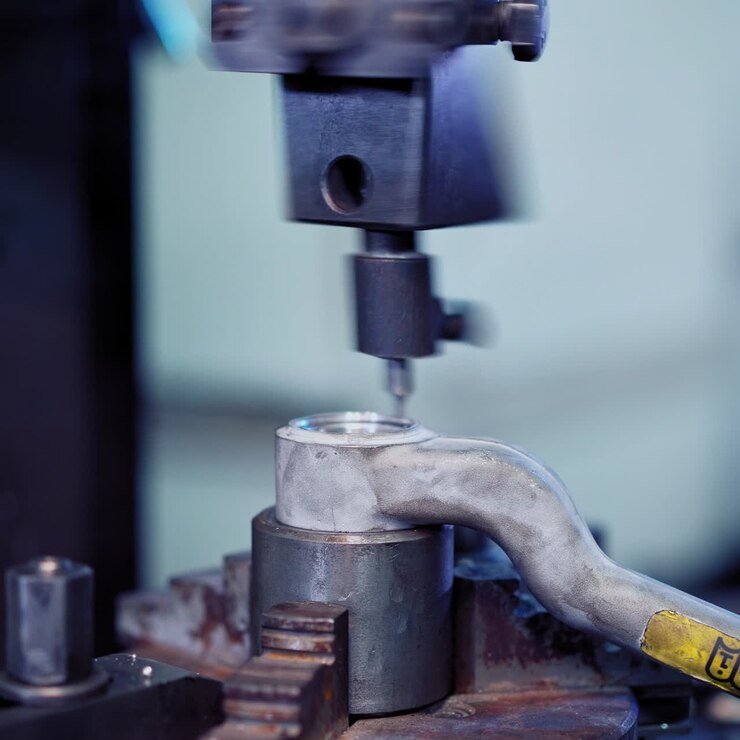 Worker in factory using machine