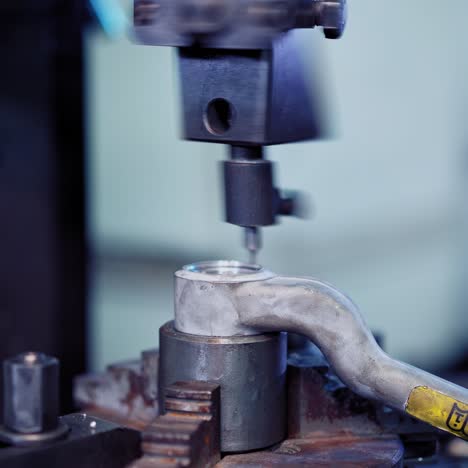 Worker in factory using machine