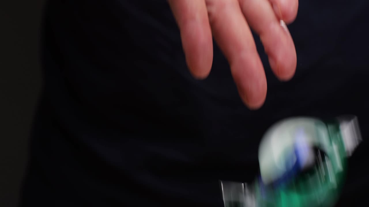 Person holding laundry detergent pods