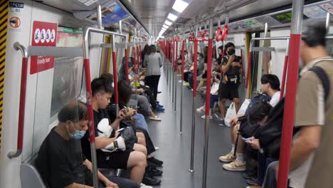 passengers inside a busy subway train