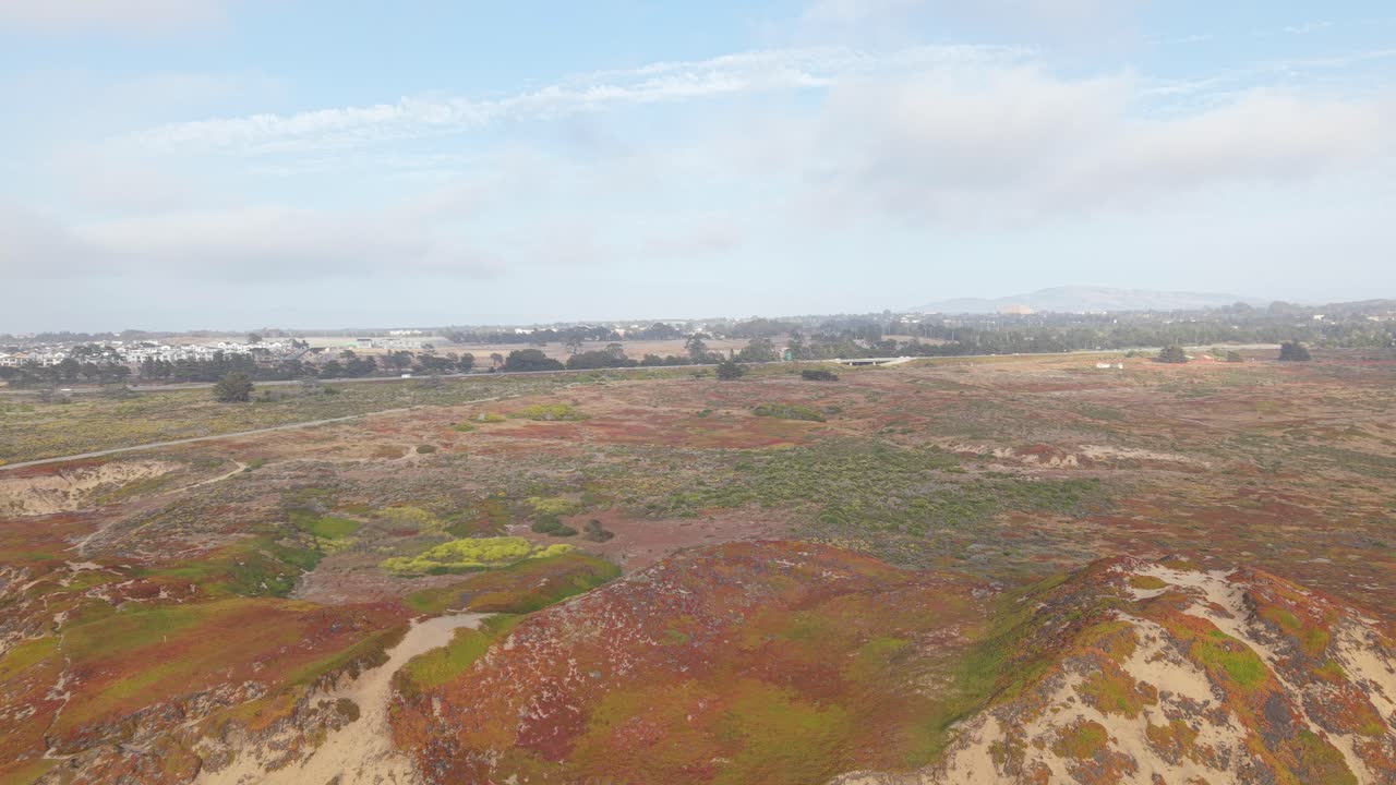 The drone captures Fort Ord Beach’s wild coastal beauty, from quiet waves to textured sand and distant hills.