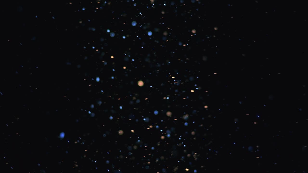 The beautiful flight of blue cosmic particles. slow motion