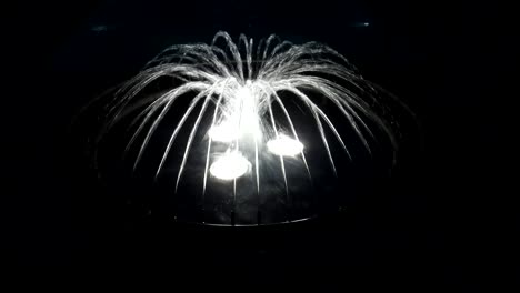 water fountain with illuminated water streams converging into center