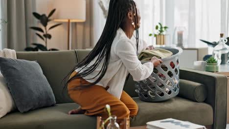 Laundry,-relax-and-a-black-woman-folding-washing