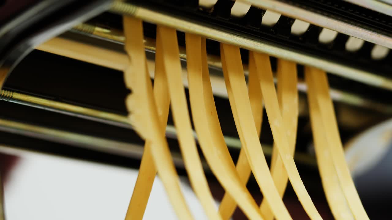 Close-up of Fresh Homemade Pasta Being Made with a Machine