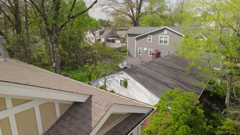 Boom-down-nice-house-in-a-suburban-neighborhood-to-the-front-yard-with-a-rainbow-flag-flying-off-the-front-porch