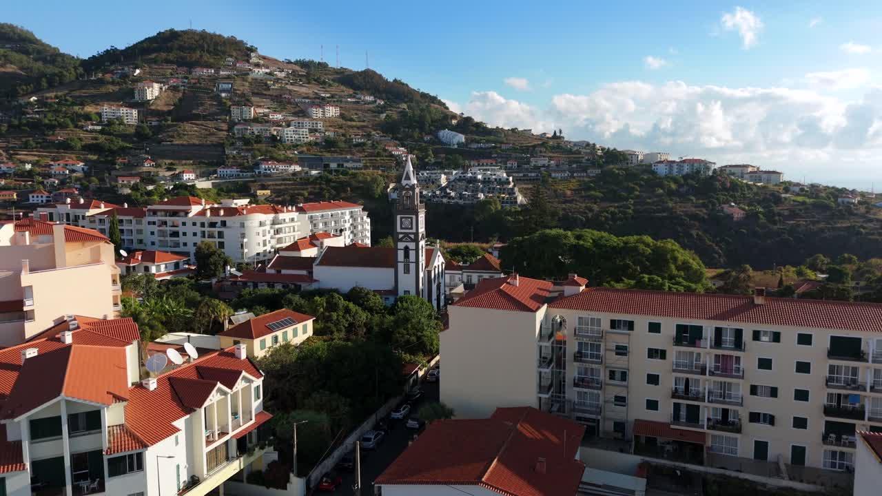 Beautiful drone shot flying over historic coastal town at summer in Portugal