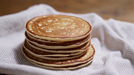 stack of pancakes on a white cloth
