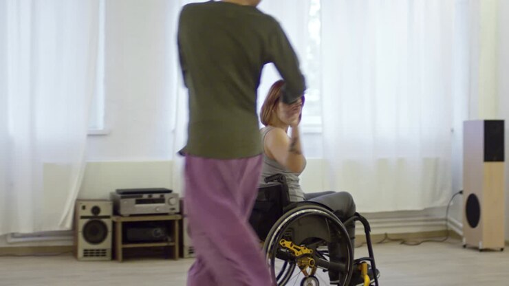 Woman in Wheelchair Performing Romantic Dance with Partner