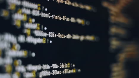 abstract blurry code on a dark screen