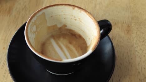 empty coffee cup on wooden table