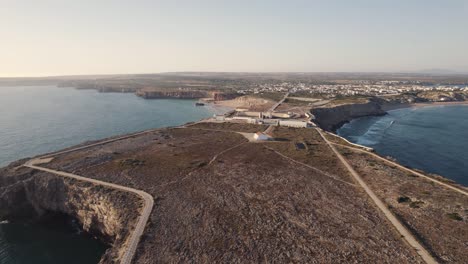 Dolly-in-aerial-view-of-defensive-wall-of-Sagres-fortress,-Fortaleza-de-Sagres-Portugal