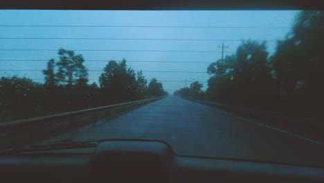 driving a long road during a foggy evening turns to nightfall in this rear window time-lapse