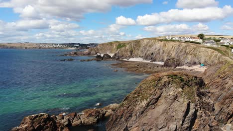 hope cove, england village: a rocky shoreline with clear blue water