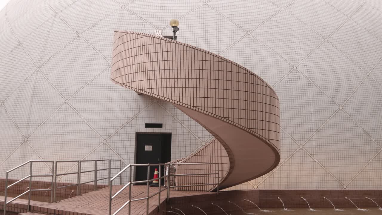 Modern Dome Building with Spiral Staircase Entrance