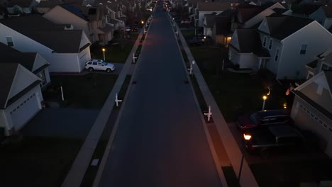 Aerial-birds-eye-shot-of-quiet-street-in-american-neighborhood-at-night