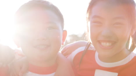 head and shoulders portrait of childrens sports team in slow motion