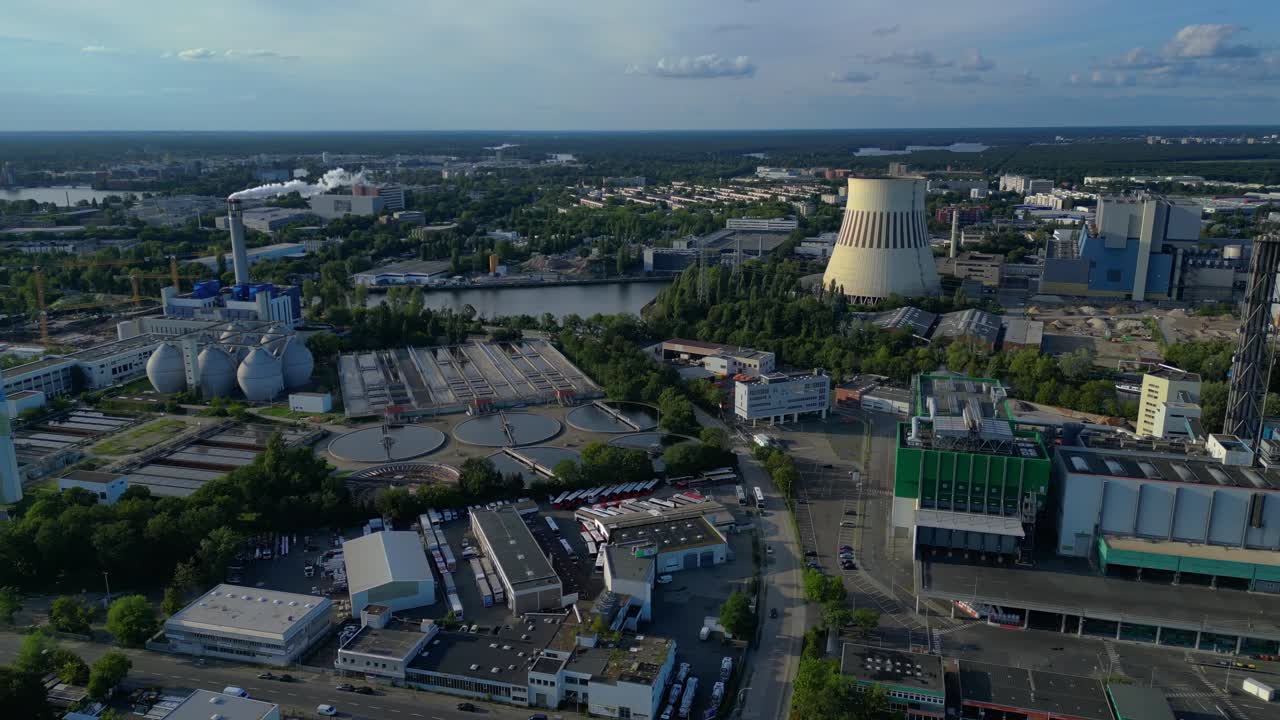 sewage treatment plant in Berlin, featuring circular clarifiers, anaerobic digesters, and other wastewater processing infrastructure. Fantastic aerial view flight drone shot from above