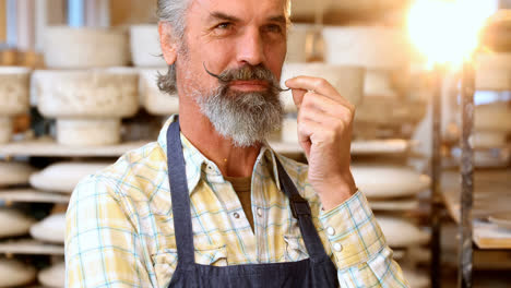 male potter standing in pottery workshop 4k