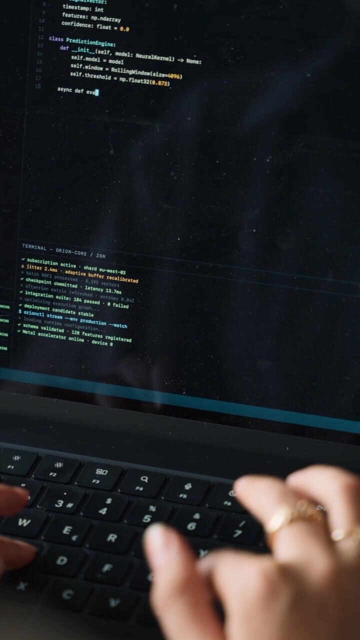 Software Developer Writing Python Code on Laptop