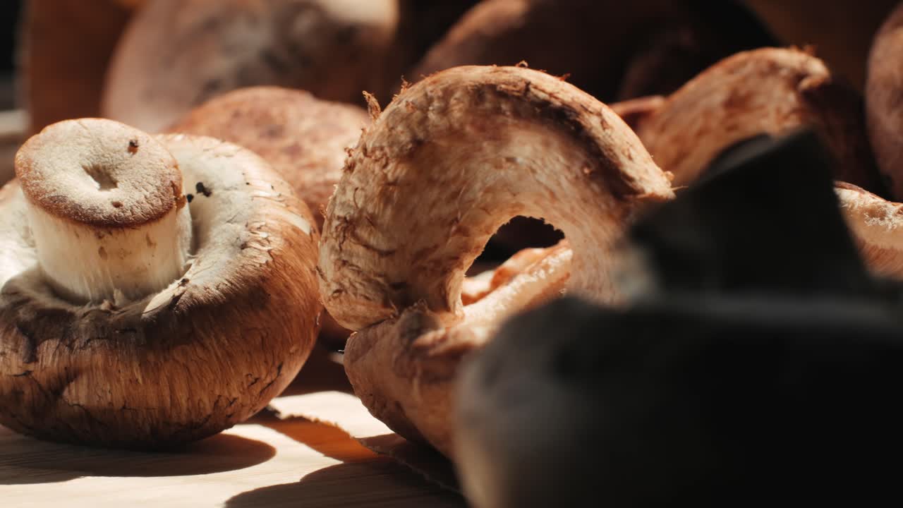 Fresh Brown Mushrooms on Wooden Cutting Board