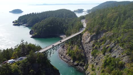 cinematic descending dolly drone shot of deception pass bridge in washington wa usa