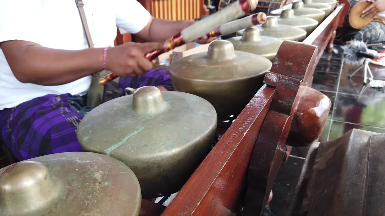 Mesmerizing closeup footage of skilled musician playing traditional Indonesian Gamelan ensemble
