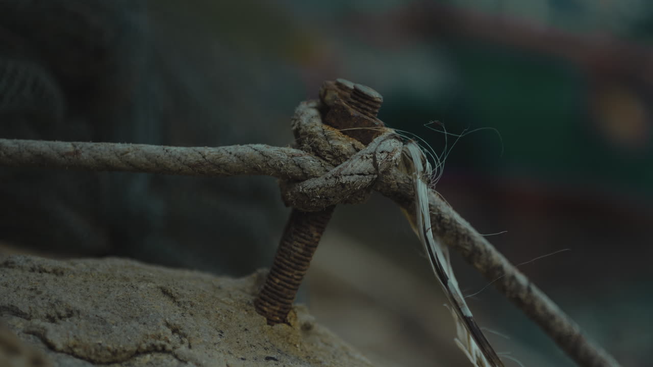 marine knot rope cose up during a storm day of rain at port dock pier