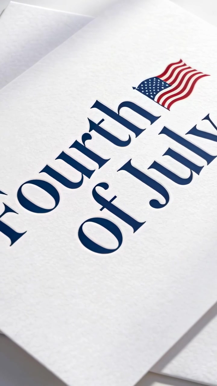 Vertical video: Starting camera pan revealing Fourth of July card on desk showing flag and sheets