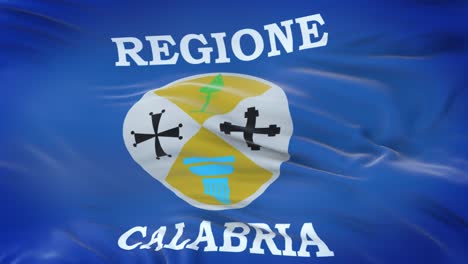 bandera de calabria (región de italia) ondeando en el viento con una textura de tela muy detallada. bucle sin costuras