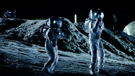 male and female astronauts wearing space suits dance on the surface of the alien planet. humanity colonizing space celebration theme.