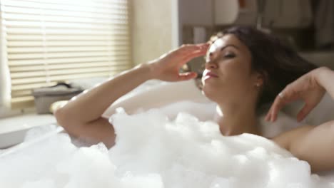 woman relaxing in a bubble bath