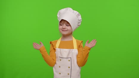girl dressed like chef cook pointing at right and left on blank space place for advertisement logo