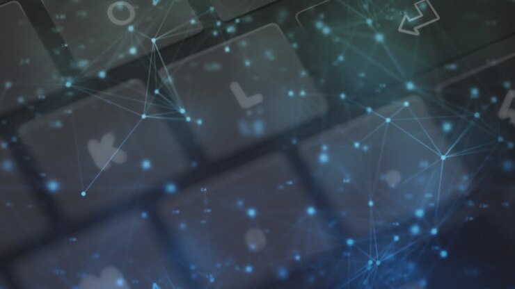 Animation of networks of connections over computer keyboard on grey background