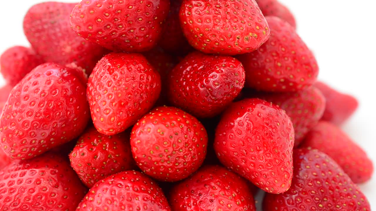 Strawberry on a white background, isolate. Shooting in the movement